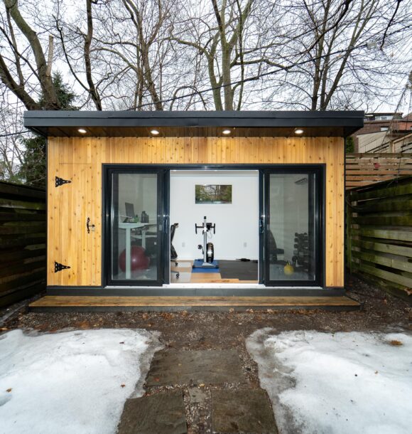 Stylish and functional garden room interior with natural light, modern furnishings, and built-in storage