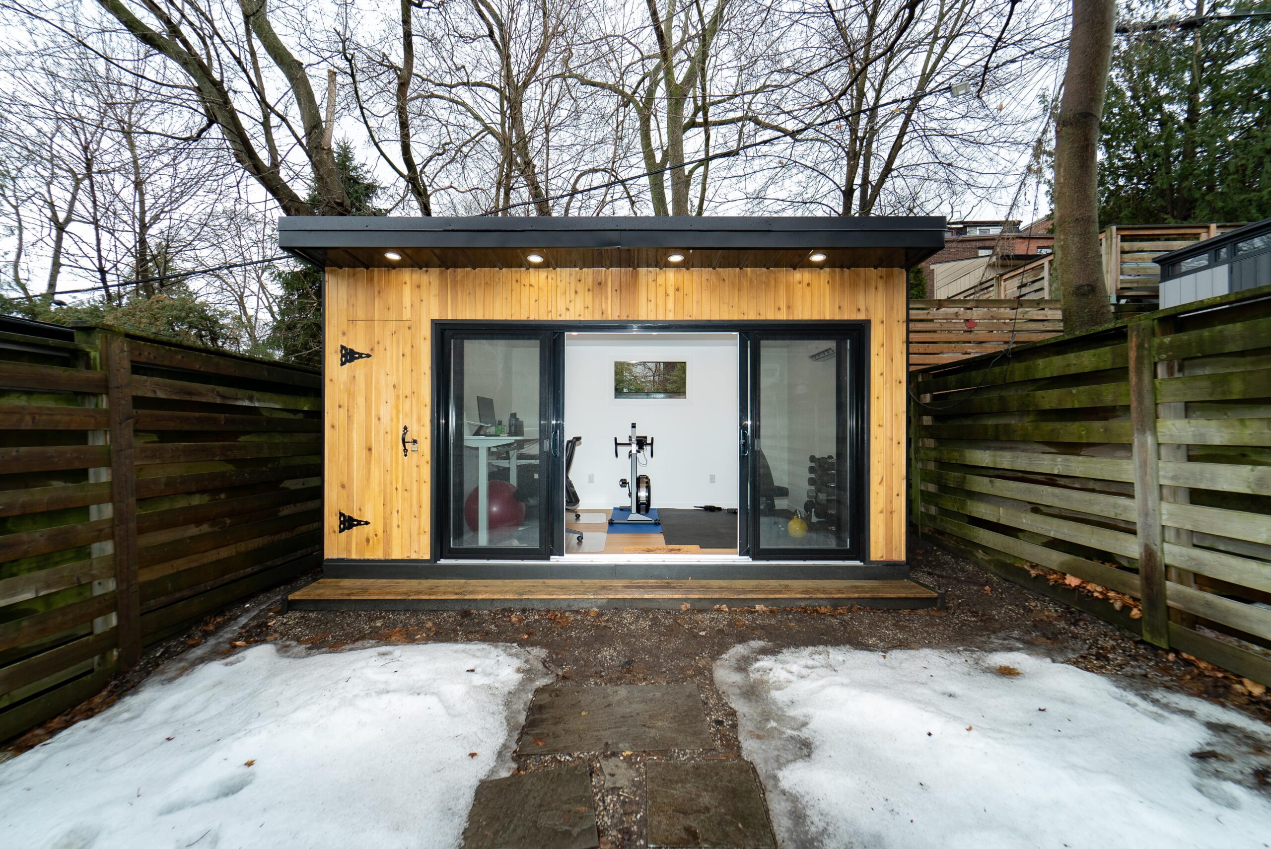 Stylish and functional garden room interior with natural light, modern furnishings, and built-in storage