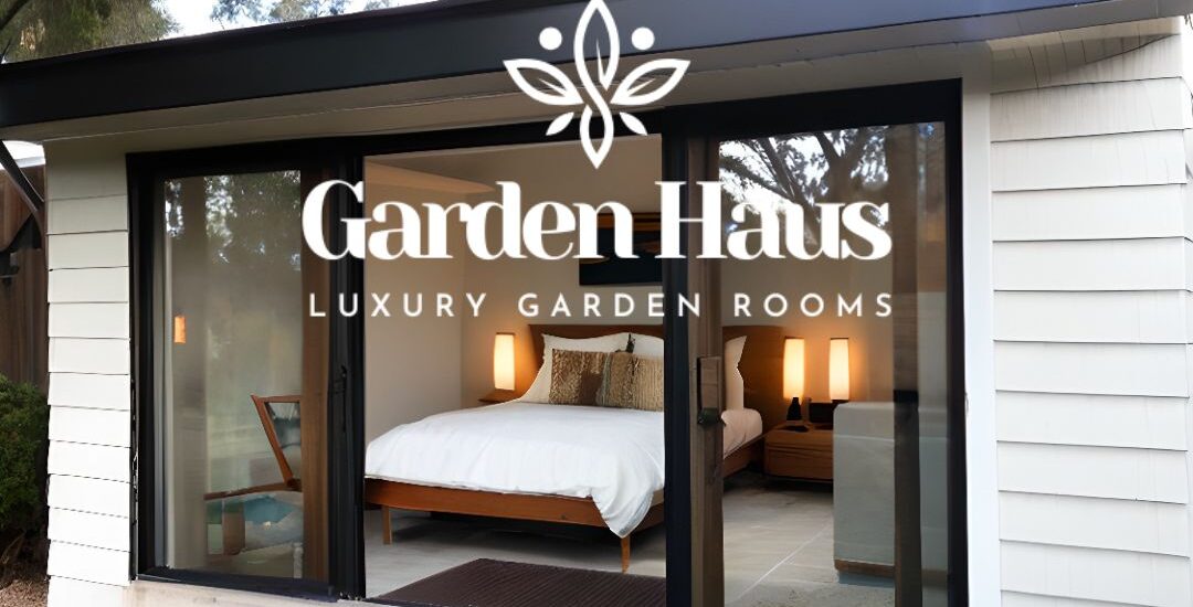 A sleek garden room with a couch, TV, and a minibar for hosting guests.