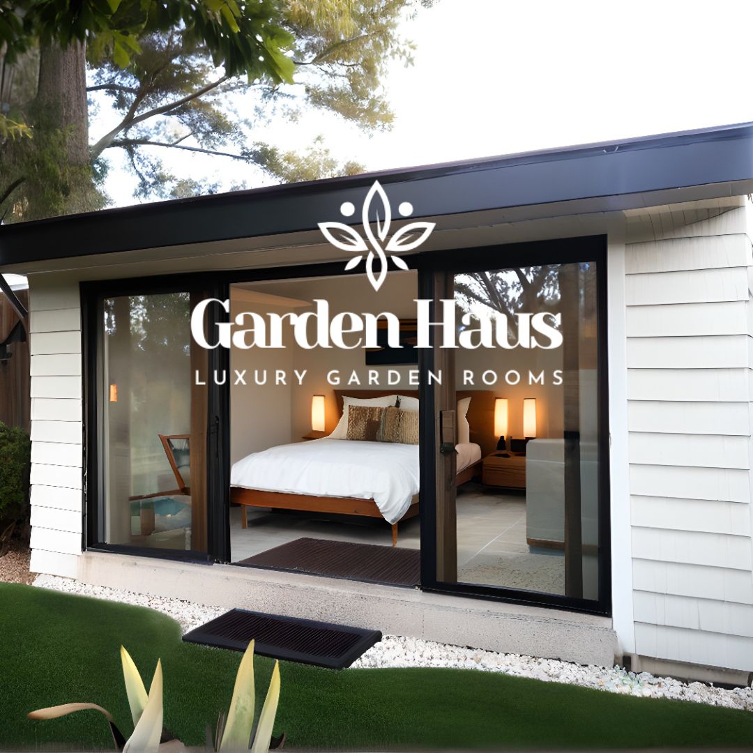 A sleek garden room with a couch, TV, and a minibar for hosting guests.