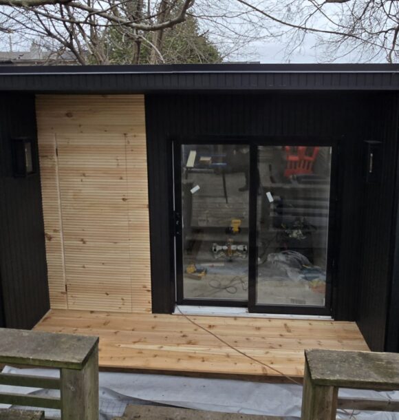 Stylish and functional garden room interior with natural light, modern furnishings, and built-in storage.