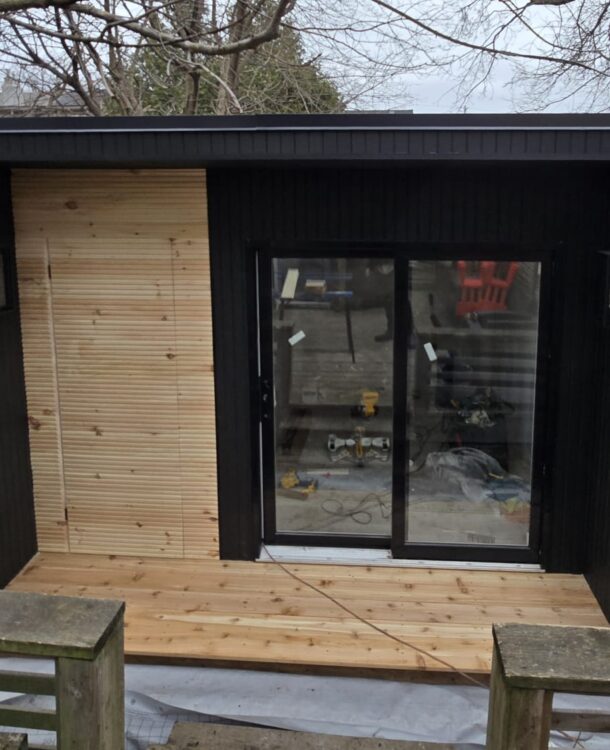Stylish and functional garden room interior with natural light, modern furnishings, and built-in storage.