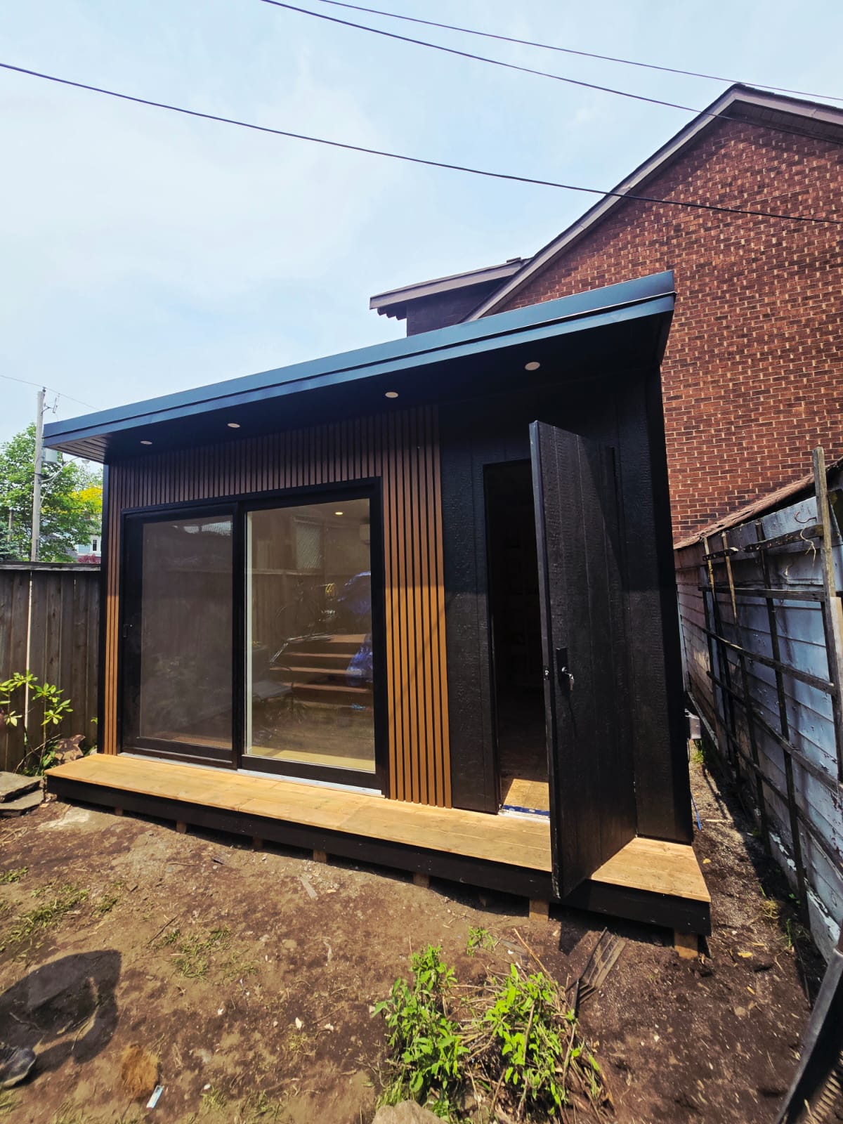 11x14 modern garden room with integrated storage, built on-site by Garden Haus.