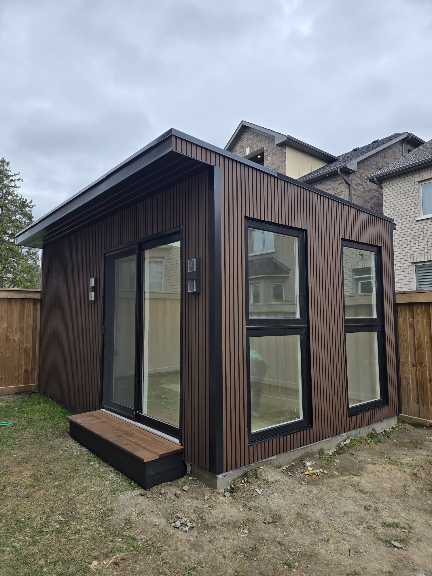 modern insulated garden room with large windows, built on-site by Garden Haus.