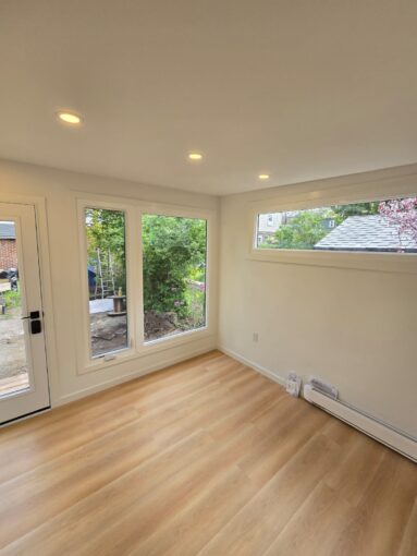 Custom backyard office garden room built by GardenHaus with floor-to-ceiling windows